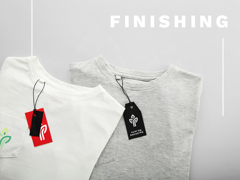 Text: Finishing; Image: Two folded t-shirts with attached hang tags. The hang tags show a company logo.