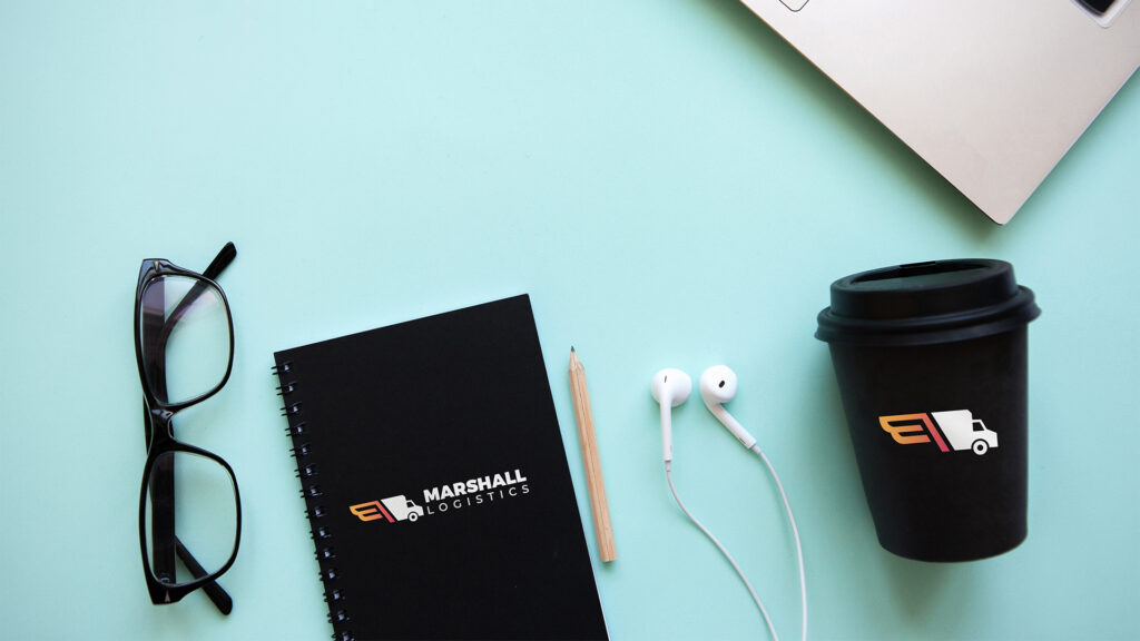 Custom branded work-from-home kit, including branded notebook and branded coffee cup for employees. 